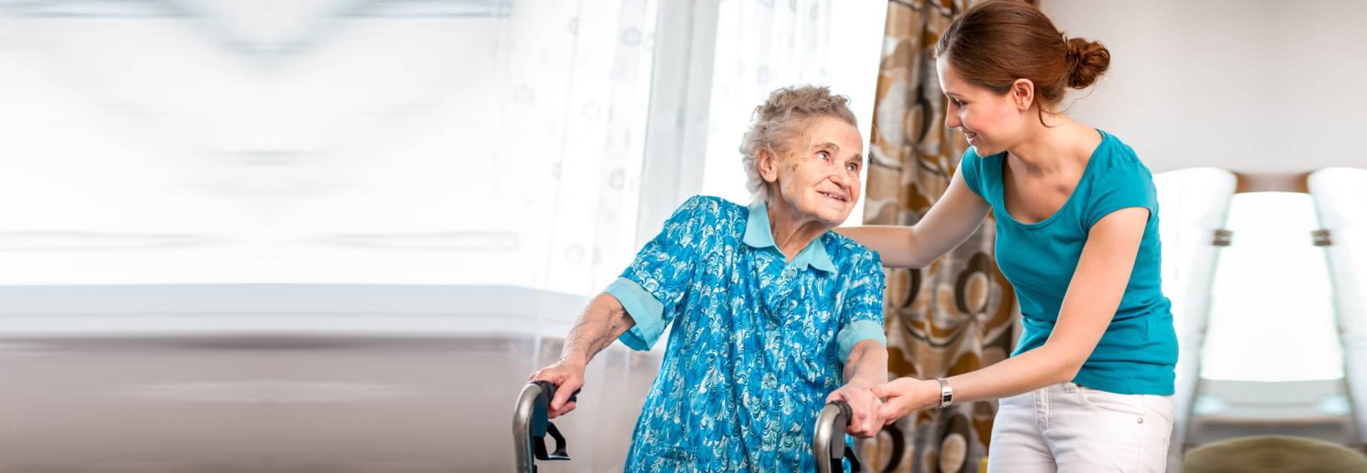 smiling caregiver talking to her patient