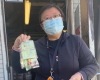 woman holding a plastic bag with chocolate and candies