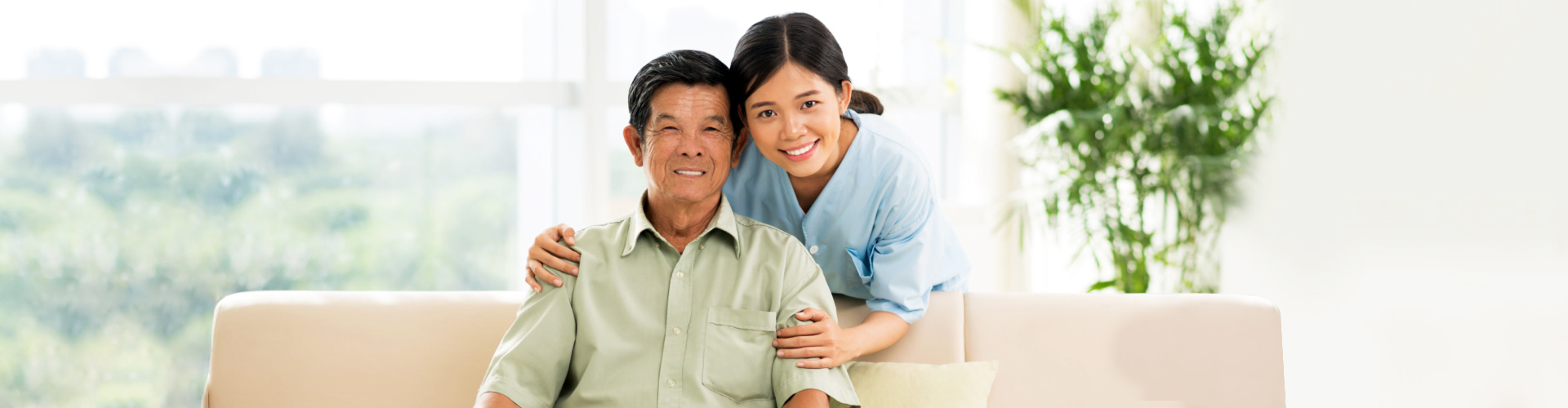 asian caregiver and her old man patient